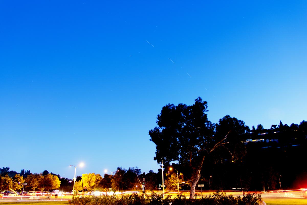 Stacked image showing five exposures of the ISS as it starts low in the SW and moves higher to the S